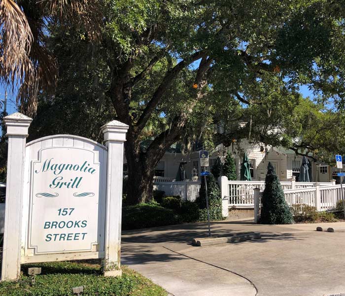 Magnolia Grill sign and parking spaces